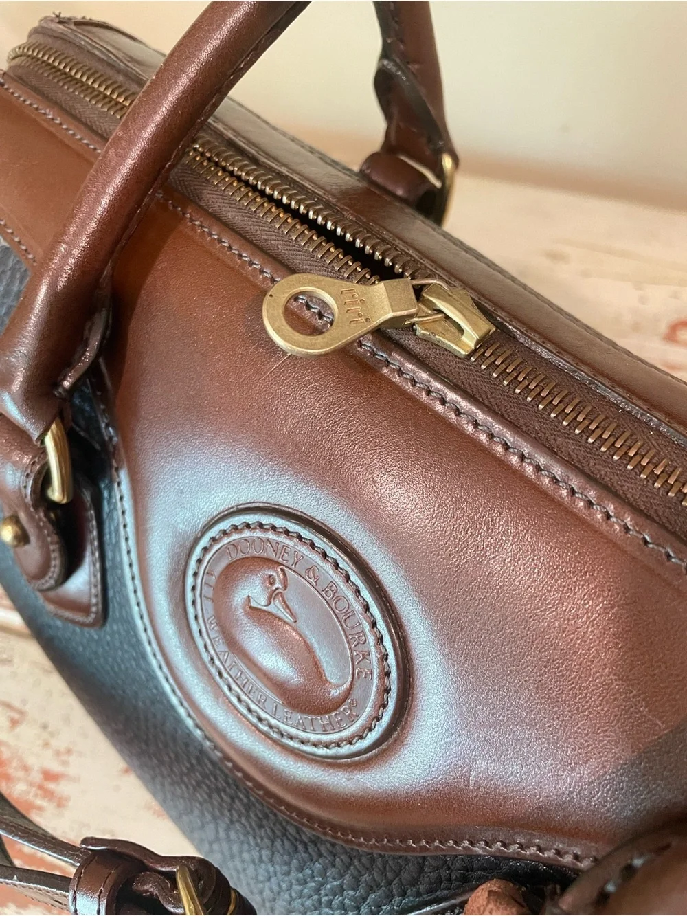 Dooney & Bourke vintage AWL Black and Brown Pebbled Leather Satchel / crossbody